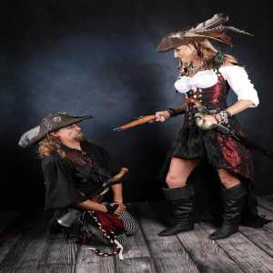 girl aims gun at guy