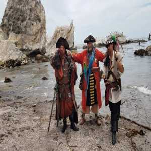 cap n guys on beach