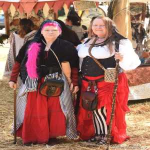 two ladies with sticks