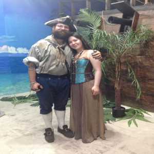 guy and girl with tropical backdrop