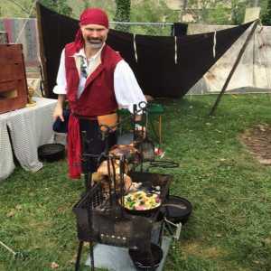 guy cooking over fire