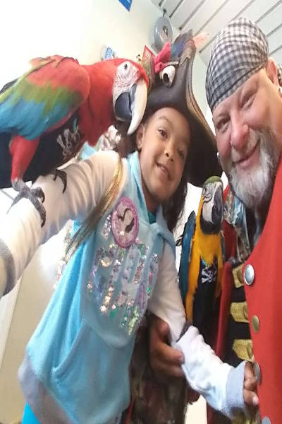cap n small girl with birds